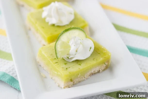 Delicious and vibrant Coconut Lime Bars, showcasing their sweet and tart layers with a tropical coconut shortbread crust.