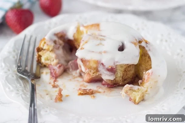Homemade Strawberry Cinnamon Rolls ready to bake, showcasing the vibrant fruit and classic cinnamon filling.