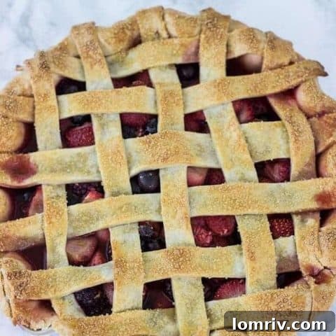 Mixed Berry Pie, golden and bubbly, fresh from the oven.