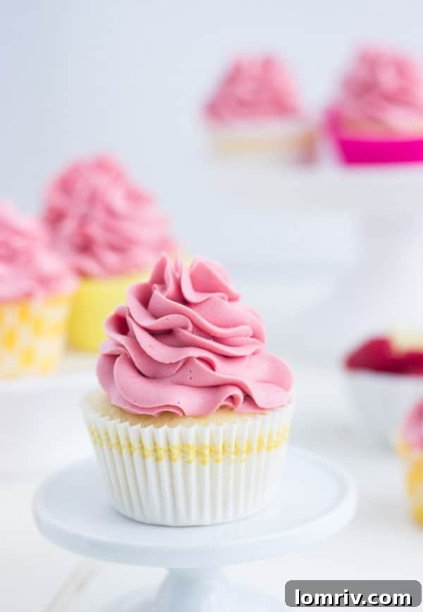 Raspberry Lemon Cupcakes - fresh lemon cupcakes filled with raspberry lemon curd and topped with a fluffy raspberry frosting.