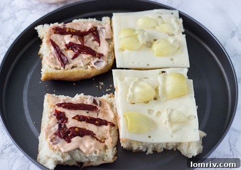 Focaccia Chipotle Sandwich before broiling, showing layers of bread, cheese, and filling