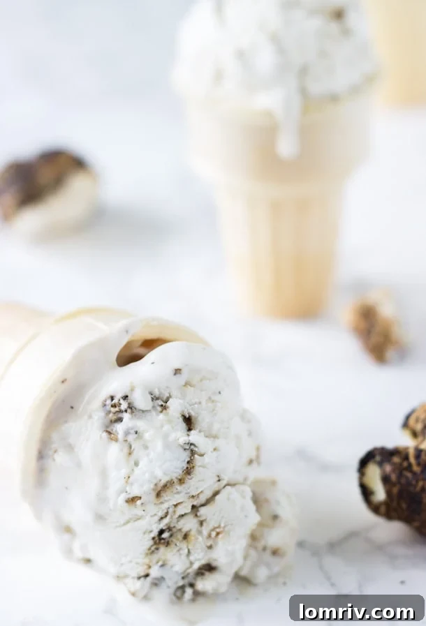 Homemade Coconut Marshmallow Fluff Ice Cream in a bowl with a spoon