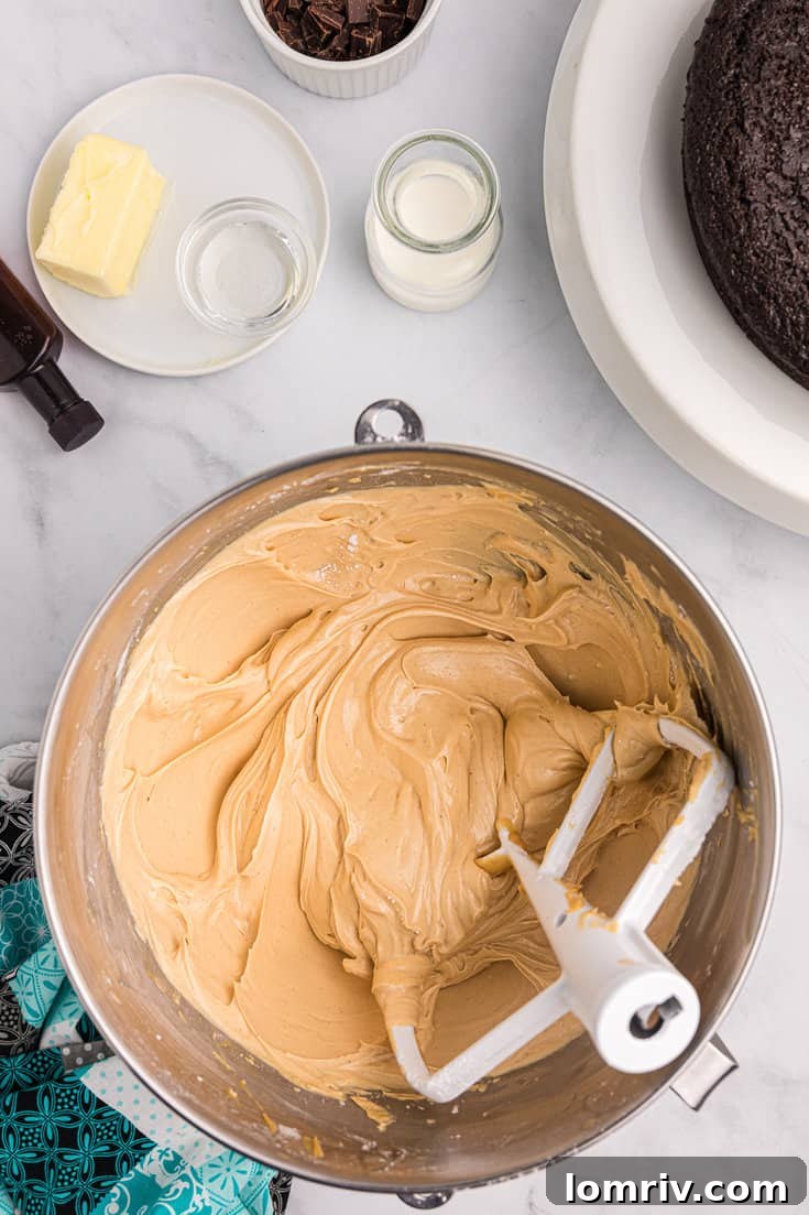 Making peanut butter frosting in a stand mixer.