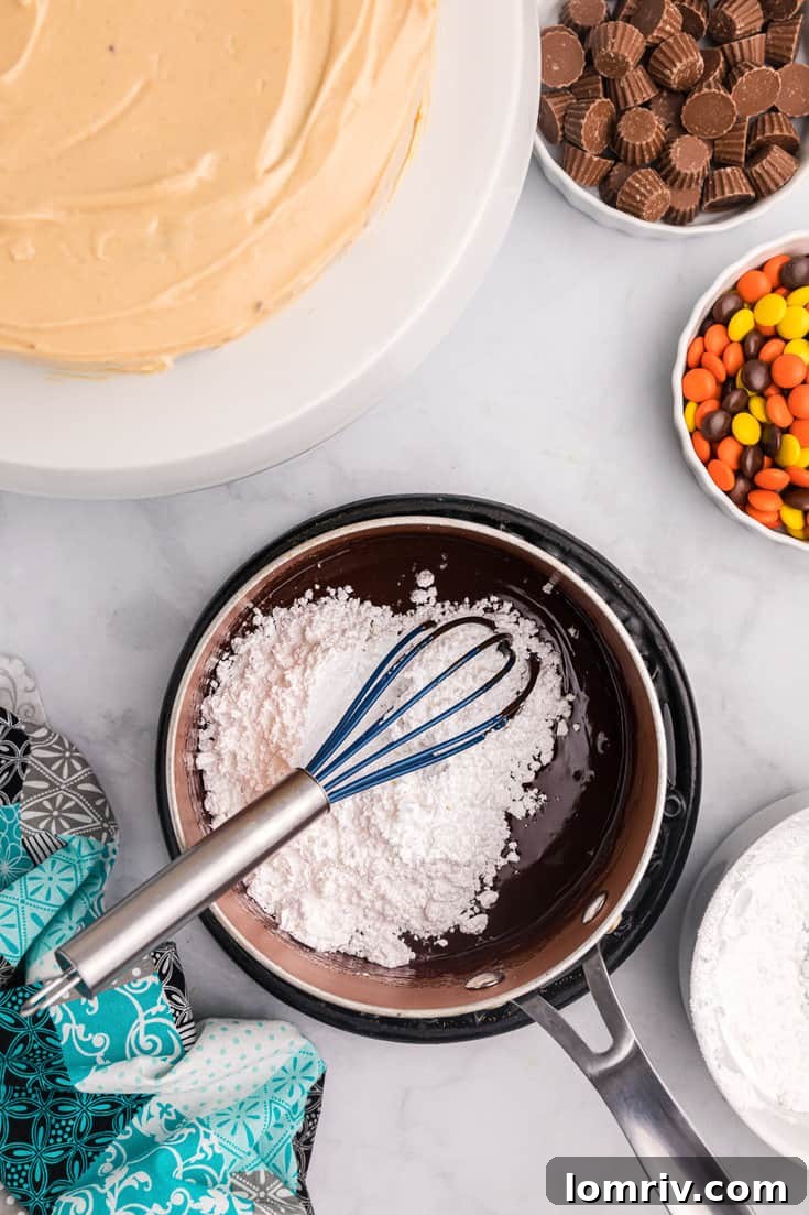Whisking chocolate ganache until smooth.