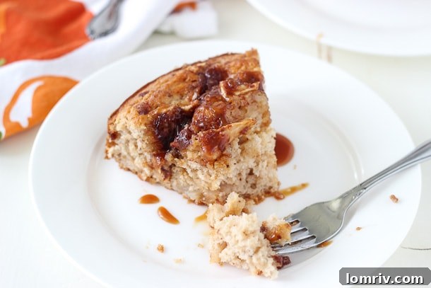 Caramel Apple Crumb Cake baked to golden perfection, showcasing its rich, textured crumb topping and a hint of caramel drizzle.